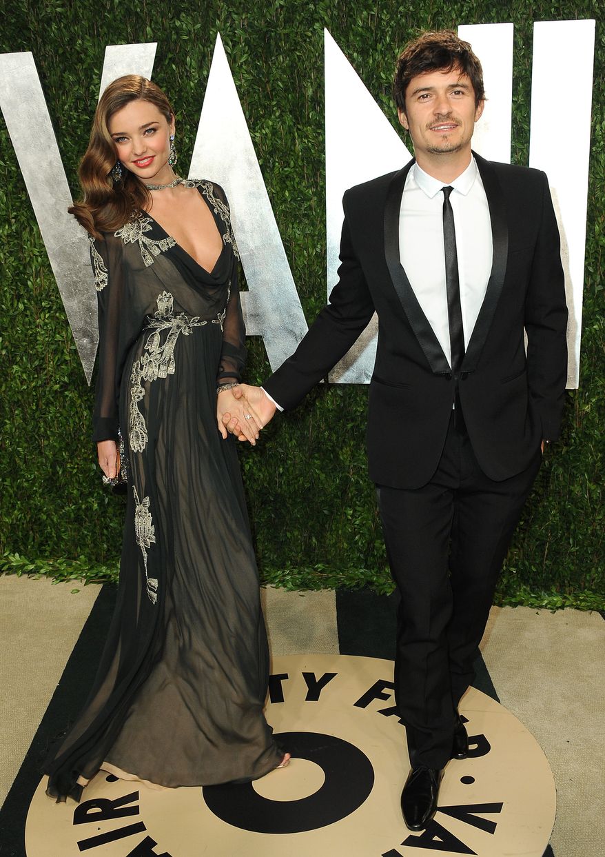 From left, model Miranda Kerr and actor Orlando Bloom arrive at the 2013 Vanity Fair Oscars Viewing and After Party on Sunday, Feb. 24 2013 at the Sunset Plaza Hotel in West Hollywood, Calif. (Photo by Jordan Strauss/Invision/AP)