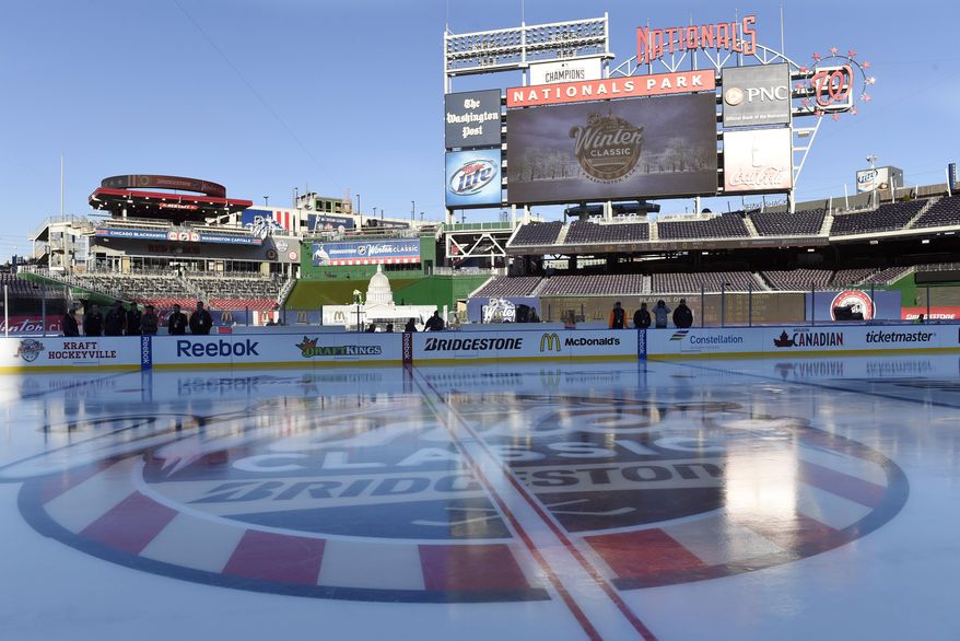 The rink at Nationals Park in Washington stands coated with ice Tuesday, Dec. 30, 2014, in preparation for the New Year&#39;s Day Winter Classic outdoor NHL hockey game between the Washington Capitals and the Chicago Blackhawks. (AP Photo/Susan Walsh)