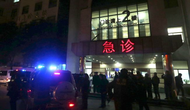 In this photo released by China&#x27;s Xinhua News Agency, medical workers stand outside the emergency ward of the No. 1 People&#x27;s Hospital of Shanghai after a stampede caused casualties among people who took part in New Year&#x27;s celebrations in Shanghai, early on Thursday,  Jan. 1, 2015. The report says the death and injuries occurred at the city&#x27;s riverfront Bund area, which can be jammed with spectators for major events.  (AP Photo/Xinhua, Ding Ting) NO SALES