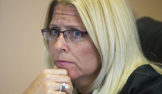 Sharon Helman, director of the Department of Veterans Affairs&#39; Phoenix clinic, was fired from the VA, but only because she improperly took thousands of dollars in gifts. A personnel appeals judge last week rejected the VA&#39;s claim that she should also have been dismissed for overseeing the wait lists. (Associated Press)