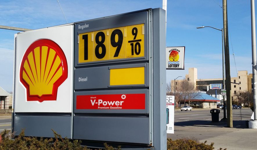 A sign shows the price of gasoline at a Shell station near downtown Detroit on Thursday, Jan. 1, 2015.  (AP Photo/David N. Goodman)