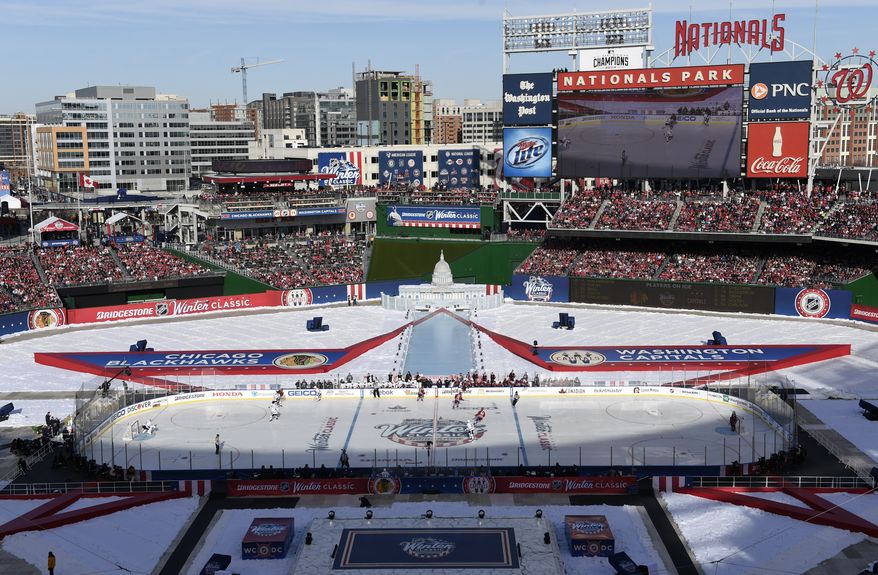 The Chicago Blackhawks face the Washington Capitals in the first period of the Winter Classic outdoor NHL hockey game at Nationals Park in Washington, Thursday, Jan. 1, 2015. (AP Photo/Susan Walsh)