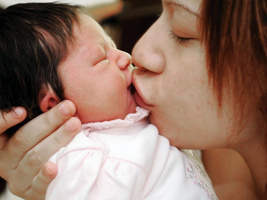 Having a new baby is both exhilarating and tiring, and new moms may find certain questions or comments to be annoying. (AP Photo/Enid News & Eagle, Bonnie Vculek)