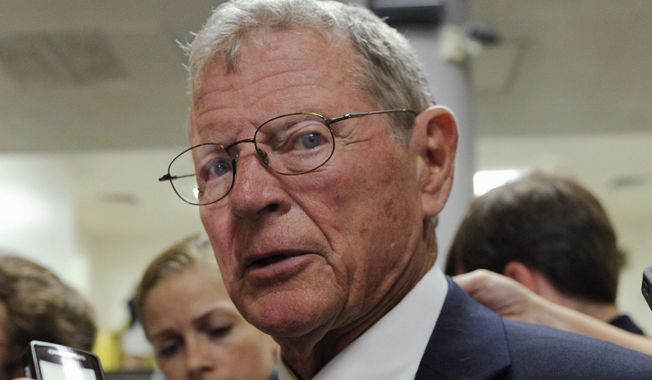 FILE - in this July 8, 2014, file photo, Sen. James Inhofe, R-Okla. speaks to reporters on Capitol Hill in Washington. Republican senators poised to lead major committees when the GOP takes charge are intent on pushing back many of President Barack Obama&#x27;s policies, setting up potential showdowns over environmental rules, financial regulations and national security. (AP Photo/Susan Walsh, File)