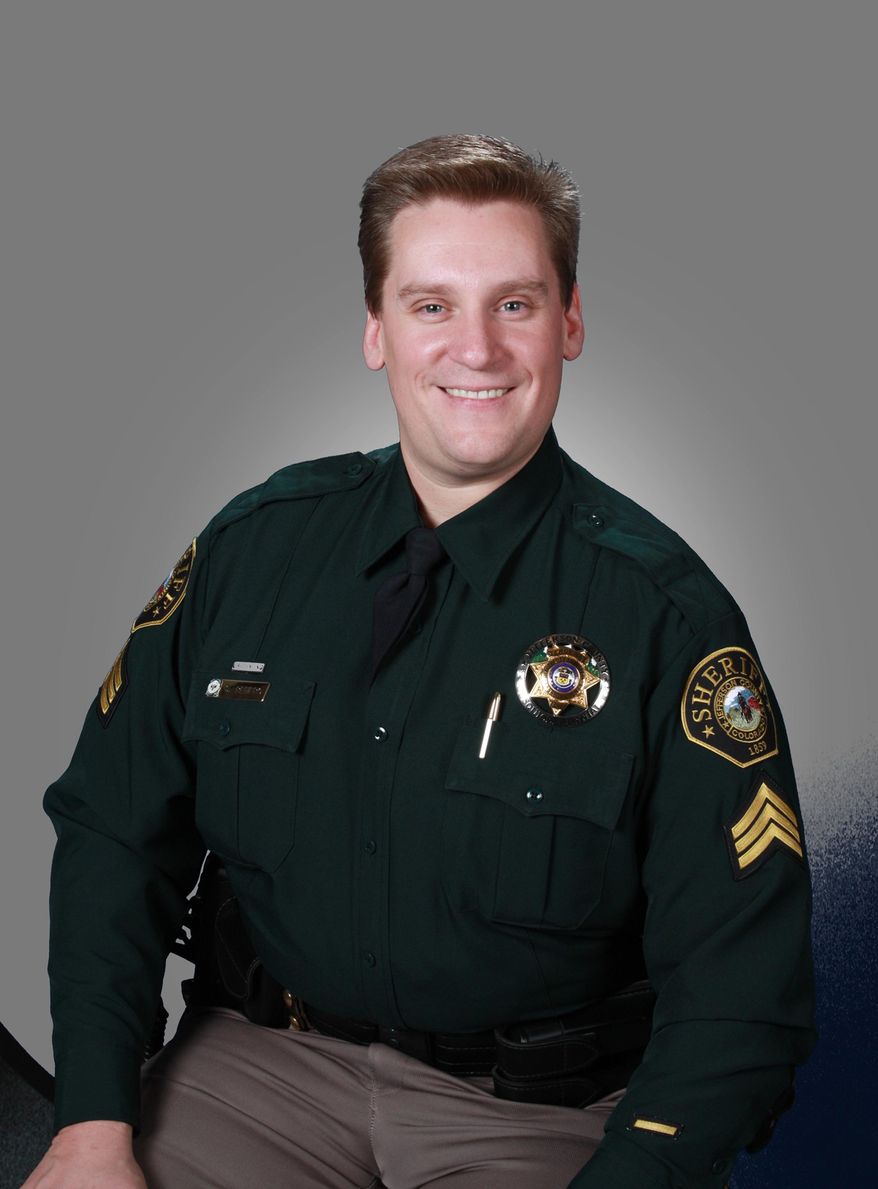 This Nov. 2, 2009 photo provided by the Jefferson County, Colo., Sheriff's Office shows Sgt. Sean Renfro. Renfro was off duty when he was killed Saturday afternoon, Jan. 3, 2015, after he was struck by a passing car at the scene of a multi-car crash on U.S. 285 north of Conifer, Colo. Authorities say Renfro was directing traffic following the crash when another car lost control and crossed the highway, striking Renfro and another car. Cpl. Heather Cobler, spokeswoman for the Colorado State Patrol, says it was snowing at the time of the accident and the road was covered with snow. (AP Photo/Jefferson County Sheriff's Office)