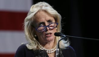 In this Nov. 4, 2014, photo, Rep.-elect Debbie Dingell, D-Mich. speaks during an election night rally in Detroit. (AP Photo/Carlos Osorio) **FILE**
