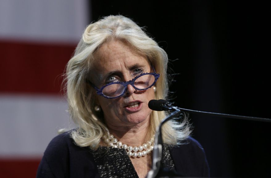 In this Nov. 4, 2014, photo, Rep.-elect Debbie Dingell, D-Mich. speaks during an election night rally in Detroit. (AP Photo/Carlos Osorio) **FILE**