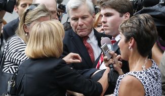 Lawyers for former Virginia Gov. Bob McDonnell, center, are seeking leniency for the governor, saying he showed mercy during his time in the state house.   (AP Photo/Steve Helber, File)  — FILE 