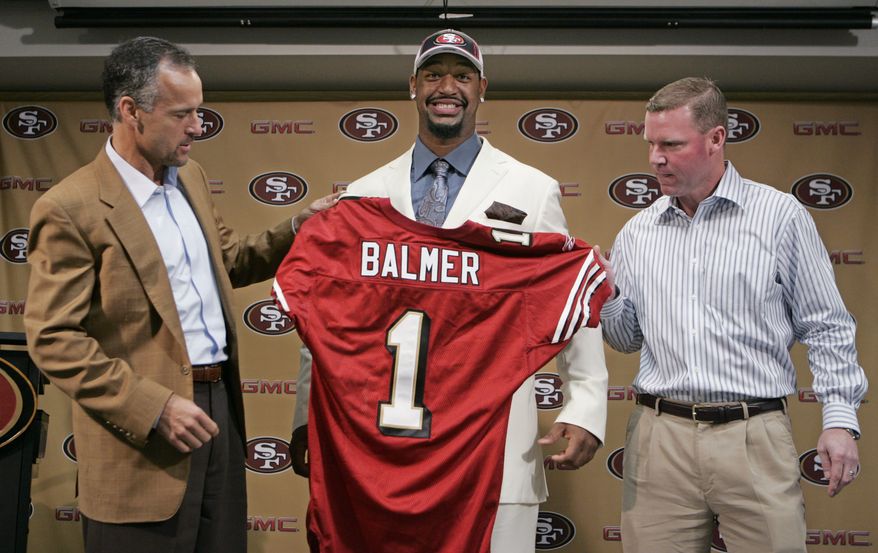 San Francisco 49ers first round football draft pick defensive tackle Kentwan Balmer, center, of North Carolina, is introduced by 49ers head coach Mike Nolan, left, and 49ers general manager Scot McCloughan, right, during a news conference at 49ers football headquarters in Santa Clara, Calif., Monday, April 28, 2008. (AP Photo/Paul Sakuma)