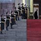 A Chinese officer, top right, looks as members of honor guard rehearse for a welcome ceremony held by Chinese President Xi Jinping for visiting Costa Rica&#39;s President Luis Guillermo Solis at the main entrance of the Great Hall of the People in Beijing, China Tuesday, Jan. 6, 2015. (AP Photo/Andy Wong)