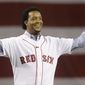 FILE - In this April 4, 2010, file photo, former Boston Red Sox pitcher Pedro Martinez greets the crowd before throwing the ceremonial first pitch before the opening game of the baseball season between the Red Sox and New York Yankees, in Boston. Martinez was elected to the National Baseball Hall of Fame Tuesday, Jan. 6, 2015. (AP Photo/Elise Amendola, File)