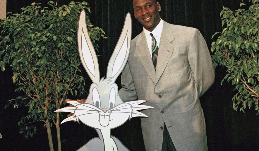 FILE: Michael Jordan poses with a cutout of Bugs Bunny at a news conference, Tuesday, June 20, 1995, in New York, where Warner Bros. announced that Mr. Jordan will join Bugs and other members of the Looney Tunes family in the original live action/animation &quot;Space Jam.&quot; (AP Photo/Marty Lederhandler)