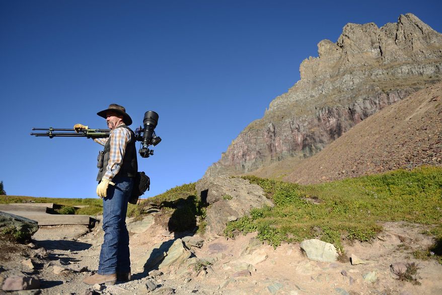 FILE - In this Sept. 13, 2013 file photo, Jim Obermeyer of Marion, Mont., makes his way up Hidden Lake Trail in Glacier National Park, Mont. If you’re looking for adventure in the New Year forget the pricey plane tickets and the passports, Montana has got you covered. (AP Photo/Daily Inter Lake, Brenda Ahearn, File)