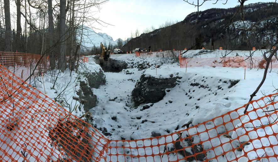 In this photo provided by the Alaska Department of Environmental Conservation, the evacuated area where diesel gasoline from a ruptured oil tanker is seen on Jan. 6, 2015, near Valdez, Alaska. The government has stepped in to continue cleaning up more than 4,000 gallons of diesel that spilled into a creek after a tanker slid off the Richardson Highway near Valdez. Much of the fuel in the Dec. 9 spill remains frozen in the roadside creek bed. The North Pole distribution company that operated the tanker doesn't have enough insurance to finish the clean-up, prompting the federal Environmental Protection Agency to assume overall command of the effort. (AP Photo/Alaska Department of Environmental Conservation, John Engles)
