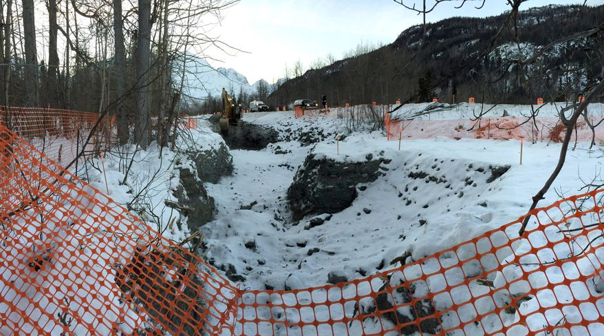 In this photo provided by the Alaska Department of Environmental Conservation, the evacuated area where diesel gasoline from a ruptured oil tanker is seen on Jan. 6, 2015, near Valdez, Alaska. The government has stepped in to continue cleaning up more than 4,000 gallons of diesel that spilled into a creek after a tanker slid off the Richardson Highway near Valdez. Much of the fuel in the Dec. 9 spill remains frozen in the roadside creek bed. The North Pole distribution company that operated the tanker doesn't have enough insurance to finish the clean-up, prompting the federal Environmental Protection Agency to assume overall command of the effort. (AP Photo/Alaska Department of Environmental Conservation, John Engles)