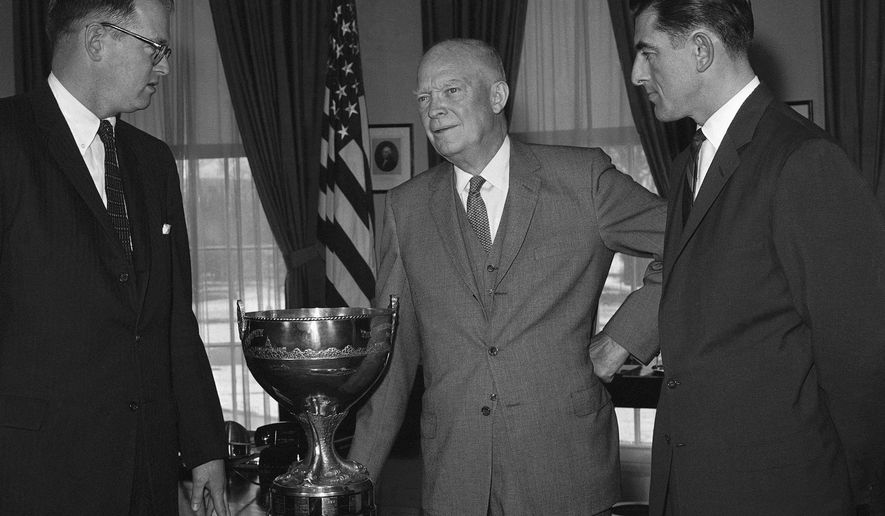 FILE - In this March 17, 1960, file photo, President Dwight Eisenhower, center, poses at the White House in Washington with Miro Slovac, right, and Bill Boeing, Jr., during a ceremony awarding them the President's Cup. Boeing died Wednesday, Jan. 7, 2015, according to the Museum of Flight in Seattle. He was 92. (AP Photo/File)