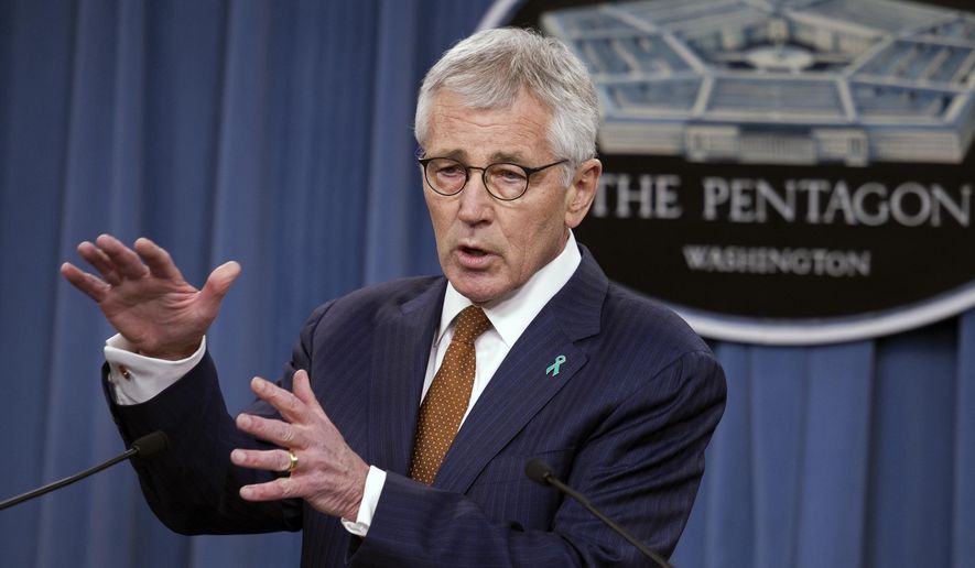 FILE - In this Dec. 4, 2014 file photo, Defense Secretary Chuck Hagel speaks at the Pentagon. The Pentagon took initial steps Friday to set up a new agency that will direct the troubled effort to search for America’s missing war dead, two years after an internal report found the current program was mismanaged and wasteful.  (AP Photo/Cliff Owen, File)