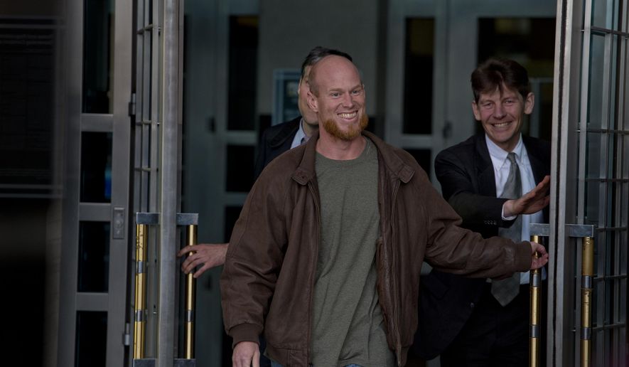 In this Thursday, Jan. 8, 2015, photo, Eric McDavid, 37, walks out of the Federal Courthouse in Sacramento with his attorney&#39;s Ben Rosenthal and Mark R. Vermeulen, right, after being released from prison. McDavid, the California man considered by the federal government to be a radical eco-terrorist and a threat to the nation, was set free after nearly nine years in prison when the government conceded that thousands of pages of evidence were never turned over to his defense attorney. (AP Photo/Sacramento Bee, Jose Luis Villegas) MAGS OUT; LOCAL TELEVISION OUT (KCRA3, KXTV10, KOVR13, KUVS19, KMAZ31, KTXL40); MANDATORY CREDIT