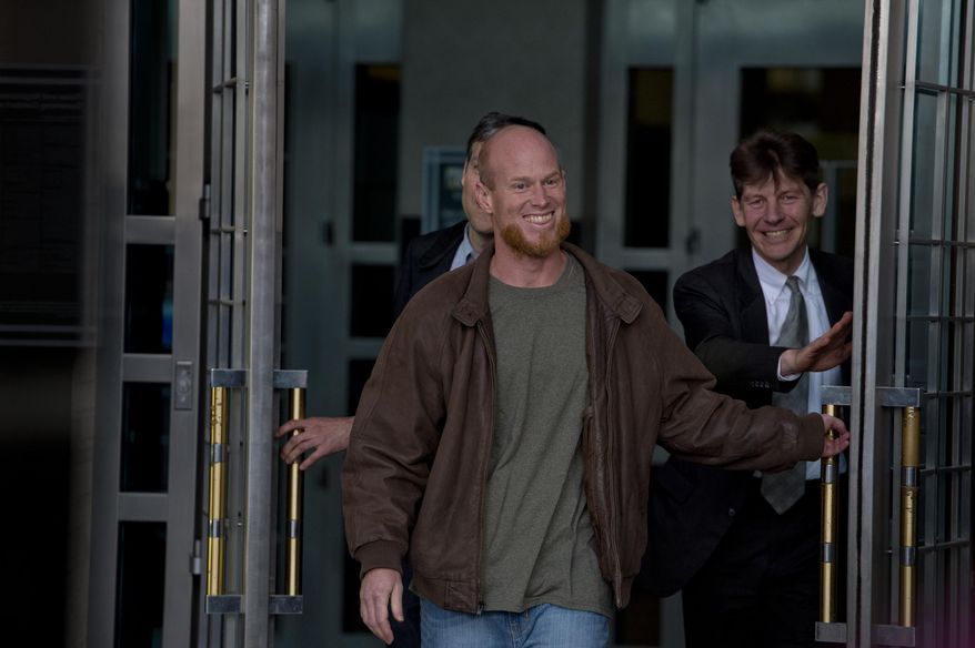 In this Thursday, Jan. 8, 2015, photo, Eric McDavid, 37, walks out of the Federal Courthouse in Sacramento with his attorney&#x27;s Ben Rosenthal and Mark R. Vermeulen, right, after being released from prison. McDavid, the California man considered by the federal government to be a radical eco-terrorist and a threat to the nation, was set free after nearly nine years in prison when the government conceded that thousands of pages of evidence were never turned over to his defense attorney. (AP Photo/Sacramento Bee, Jose Luis Villegas) MAGS OUT; LOCAL TELEVISION OUT (KCRA3, KXTV10, KOVR13, KUVS19, KMAZ31, KTXL40); MANDATORY CREDIT