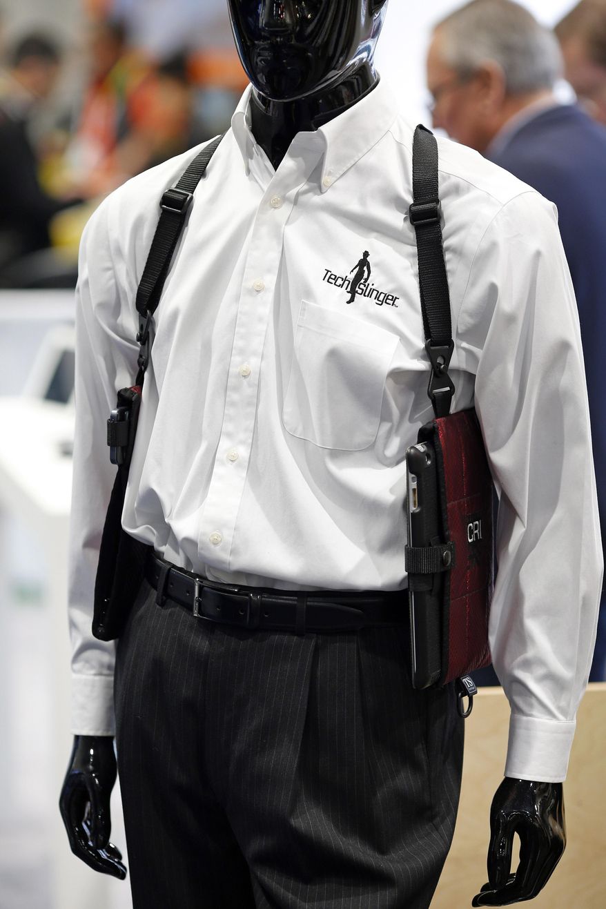 The TechSling smart device holster is displayed at the Tech Slinger booth during the International CES, Thursday, Jan. 8, 2015, in Las Vegas. (AP Photo/John Locher)