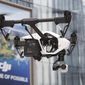 In this Monday, Dec. 15, 2014, photo, a DJI Technology Co.&#39;s Inspire 1 drone flies against the backdrop of a DJI&#39;s advertisement board during a demonstration in Shenzhen, south China&#39;s Guangdong province. (AP Photo/Kin Cheung) ** FILE **