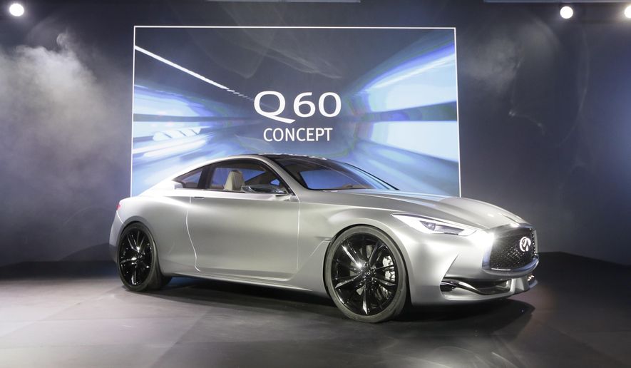 The Infiniti Q60 concept is unveiled at the Museum of Contemporary Art Detroit, Sunday, Jan. 11, 2015 in Detroit. Infiniti says the Q60 that will go on sale next year will be strongly influenced by the Q60 concept. (AP Photo/Carlos Osorio)