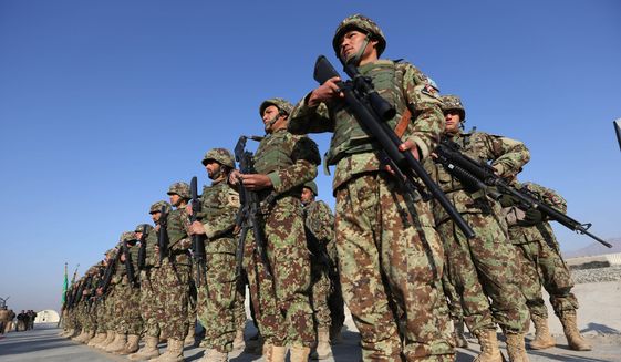 Afghan security forces attend a ceremony in Laghman province, east of Kabul, Afghanistan, in this Sunday, Jan. 11, 2015, file photo. (AP Photo/Rahmat Gul) ** FILE **
