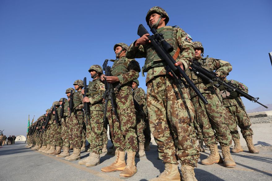 Afghan security forces attend a ceremony in Laghman province, east of Kabul, Afghanistan, in this Sunday, Jan. 11, 2015, file photo. (AP Photo/Rahmat Gul) ** FILE **