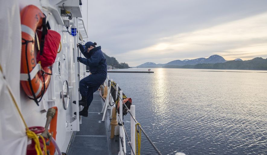 ADVANCE FOR SUNDAY JAN. 18 AND THEREAFTER - In this Jan. 8, 2015 photo, United States Coast Guard Lt. j.g. Rebecca Rebar climbs down from the bridge of the cutter Chandeleur. The Chandeleur, a 110-foot cutter with a 17-person crew that was commissioned in 1988, went back in the water on Dec. 30 after being in the base’s dry dock since late July, according to Lt. Rebar, the cutter’s executive officer. (AP Photo/Ketchikan Daily News, Taylor Balkom)
