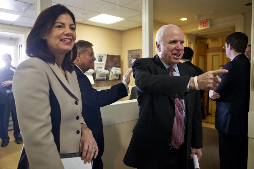 From left, Sen. Kelly Ayotte, R-N.H., Sen. Lindsey Graham, R-S.C., and Senate Armed Services Committee Chairman Sen. John McCain, R-Ariz., arrive before a news conference on Capitol Hill in Washington, Tuesday, Jan. 13, 2015, to discuss the federal prison at Guantanamo Bay, Cuba. Four powerful Republican senators are pushing for new restrictions on President Barack Obama's ability to transfer terror suspects out of the federal prison at Guantanamo Bay, Cuba. (AP Photo/Jacquelyn Martin)