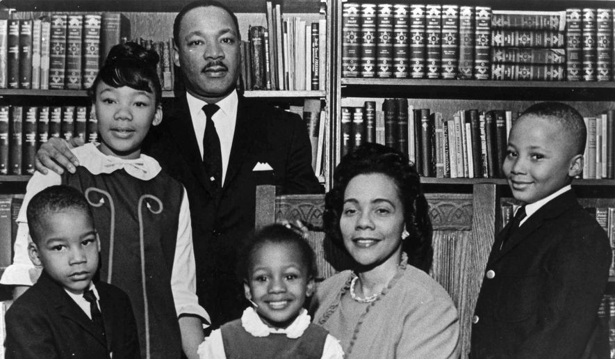 This 1966 file photo is the last official portrait taken of the entire King family, made in the study of Ebenezer Baptist Church in Atlanta. From left are Dexter King, Yolanda King, Martin Luther King Jr., Bernice King, Coretta Scott King and Martin Luther King III. (AP Photo)
