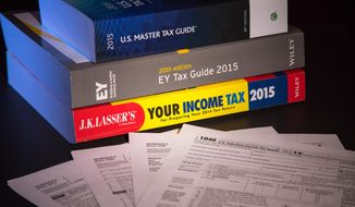 In this Frday, Jan. 9, 2015 photo, three of several commercially available tax guides to help prepare this year&#39;s tax return are photographed in Washington. “There’s a lot to look for. It is kind of complicated. This is not easy stuff,” said Barbara Weltman, contributing editor to the tax guide &amp;quot;J.K. Lasser&#39;s Your Income Tax 2015.&amp;quot; She said the good news is that most people use a paid preparer or software to do their taxes, and they’ll be walked through the questions that have to be answered for the health insurance section of the tax return.  (AP Photo/J. David Ake)