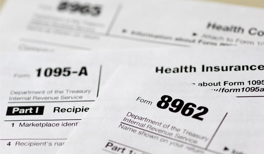 This Aug. 21, 2014, file photo shows health care tax forms 8962, 1095-A, and 8965, in Washington. Being uninsured in America will cost you more in 2015. In 2015, all taxpayers have to report to the Internal Revenue Service for the first time whether or not they had health insurance the previous year. Most will check a box. It’s also when the IRS starts collecting fines from some uninsured people, and deciding if others qualify for exemptions. (AP Photo/Carolyn Kaster, File)