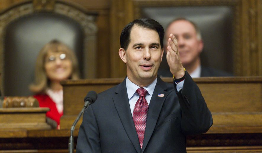 Wisconsin Gov. Scott Walker acknowledges people in the gallery during Governor&#39;s State of the State address to a joint session of the Legislature in the Assembly chambers at the state Capitol, Tuesday, Jan. 13, 2015, in Madison, Wis. (AP Photo/Andy Manis)