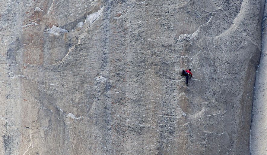 In this Jan. 12, 2015 photo provided by Tom Evans, Kevin Jorgeson climbs what has been called the hardest rock climb in the world: a free climb of El Capitan, the largest monolith of granite in the world, a half-mile section of exposed granite in California's Yosemite National Park. El Capitan rises more than 3,000 feet above the Yosemite Valley floor. The first climber reached its summit in 1958, and there are roughly 100 routes up to the top. (AP Photo/Tom Evans, elcapreport)