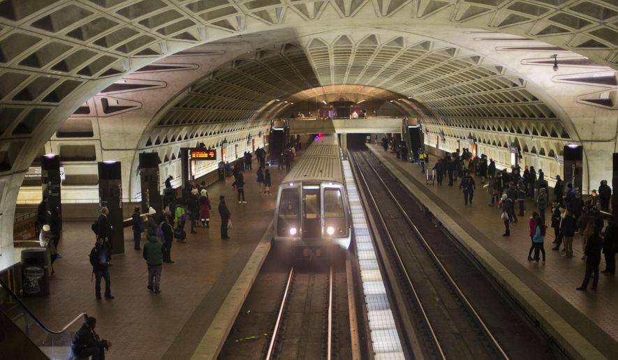 A subway train arrives Jan. 13, 2015, at the L&#x27;Enfant Metro Station in Washington, D.C., which is part of the region&#x27;s public mass transit network. (Associated Press) ** FILE **