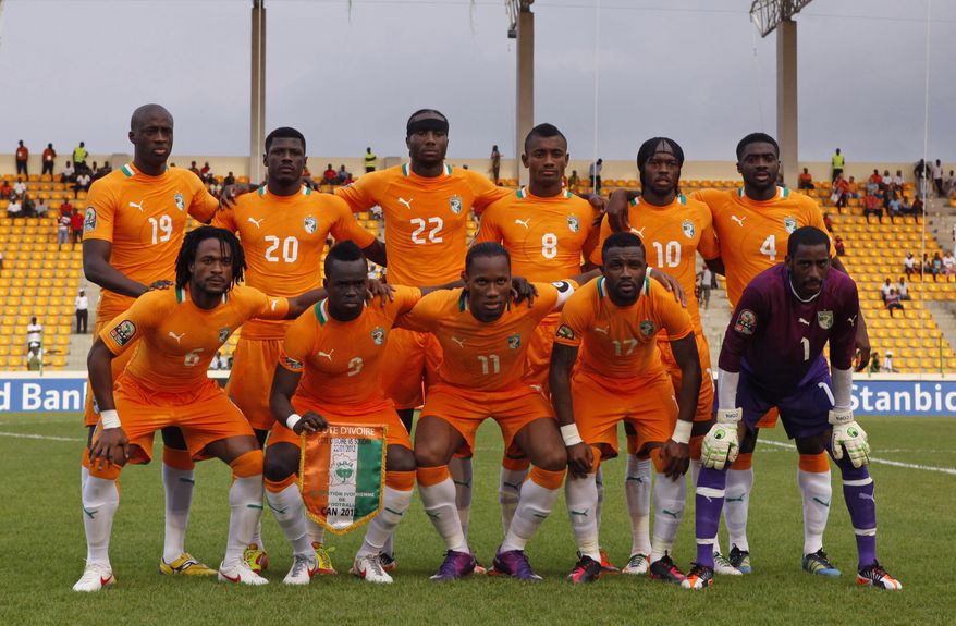 FILE- In this file photo taken on Sunday, Jan. 22, 2012, Ivory Coast's national soccer team poses for a team picture before the start of their African Cup of Nations Group B match against Sudan at Malabo Stadium in Malabo, Equatorial Guinea, Back row, from left, are Yaya Toure, Igor Lolo, Souleymane Bamba, Salomon Kalou, Gervinho, Kolo Toure. Front row, from left, are Jean-Jacques Gosso Gosso, Cheick Tiote, captain Didier Drogba, Siaka Tiene, and goalkeeper Boubacar Barry. After Morocco was stripped of hosting rights, the African Cup of Nations is back in the tiny Central African nation of Equatorial Guinea for the second time in three years. (AP Photo/Rebecca Blackwell, File)