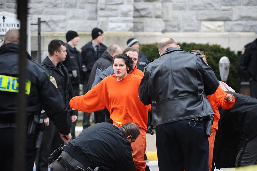 An inmate is searched while being escorted from Northumberland County Prison in Sunbury, Pa., Wednesday, Jan. 14, 2015. Dispatchers say the blaze was reported just after 2 p.m. at the nearly 140-year-old jail in the city of 10,000 about 40 miles north of Harrisburg, Pa. (AP Photo/The News-Item, Larry Deklinski)