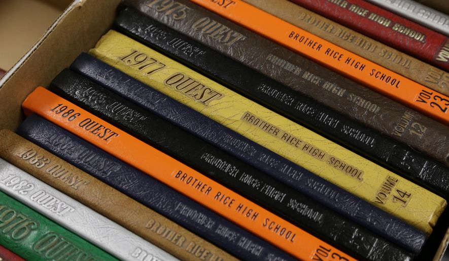 A selection of old Catholic High School yearbooks that have been collected over the years by the Jewish Historical Society of Michigan on display on Dec. 18, 2014 at the Jewish Community Center in West Bloomfield, Mich. Recently, the Jewish group donated several dozen Catholic school yearbooks to the Bishop Michael J. Gallagher Society, which is spearheading the Detroit Catholic School Heritage Project to collect, showcase and digitize memorabilia from long-gone and current metro Detroit Catholic schools. (AP Photo/Detroit Free Press, Ryan Garza) DETROIT NEWS OUT; NO SALES