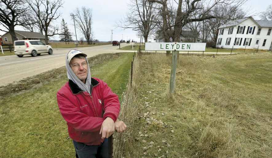 ADVANCE FOR WEEKEND EDITIONS JAN. 18-19 - In this photo taken Dec. 17, 2014, Gaylen Reilly, who has lived his entire life within a half mile of the tiny Rock County community known as Leyden, Wis., poses for a photo. Although never incorporated, Leyden had a railroad depot, a creamery, general store and more. Now most people just drive by the tiny collection of homes on highwat 14, unaware of the history. (AP Photo/The Janesville Gazette, Bill Olmsted)