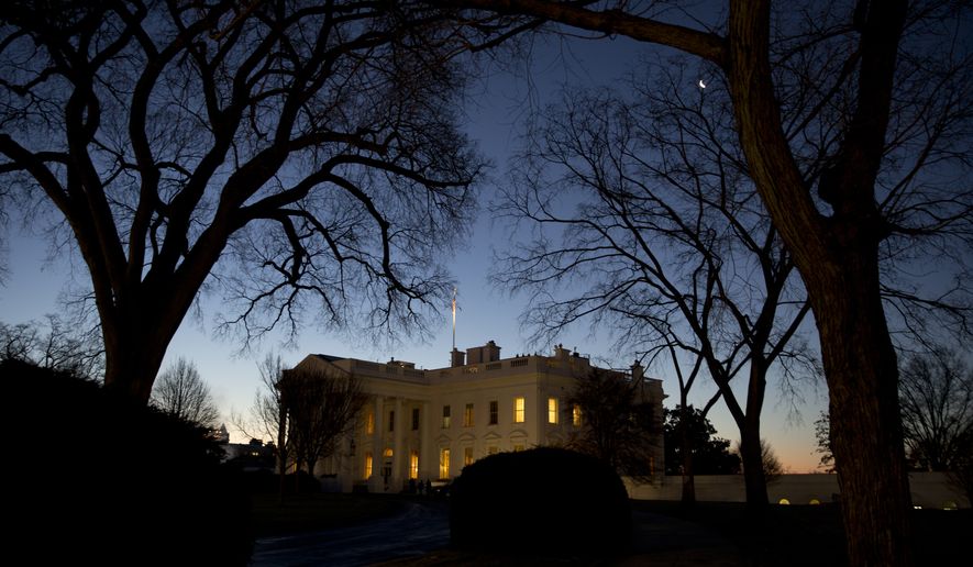 The White House is seen as the sun rises in Washington, Friday, Jan. 16, 2015. (AP Photo/Carolyn Kaster)