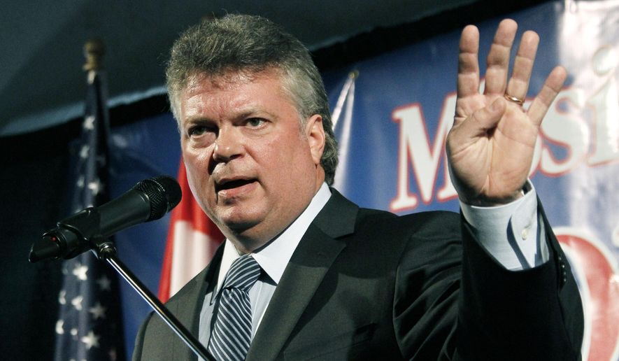 FILE - In this Oct. 31, 2012 file photo, Mississippi Attorney General Jim Hood speaks before the Mississippi Economic Council's annual Hobnob in Jackson. Hood says a suit against him by Google should be dismissed. Hood argues the Internet search giant’s assertion that it is protected by federal law fails to invalidate state laws under which he’s investigating, and that Google has jumped the gun because Hood doesn’t know what information his inquiry will yield. Hood also denies his investigation will chill Google’s speech rights. A hearing in the case is set for Feb. 13, 2015 in Jackson before U.S. District Judge Henry T. Wingate. (AP Photo/Rogelio V. Solis)