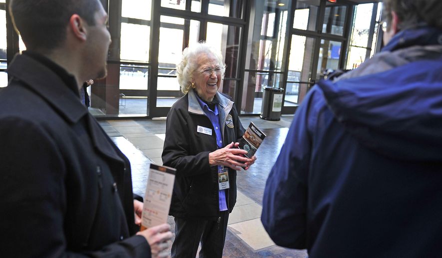 Rose Lee Maphis greets visitors Bruno Ferrari, left, and Marcus Haug at the Country Music Hall of Fame and Museum on Jan. 5, 2015 in Nashville, Tenn. During the 1950s and 1960s, Rose Lee Maphis and her husband, Joe, ranked as one of show business's most successful husband-and-wife duos — known by many as "Mr. and Mrs. Country Music." (AP Photo/The Tennessean, Jae S. Lee ) NO SALES