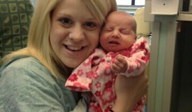 In this undated photo provided by the family, Aileen Dannelley holds her baby, Savannah, at Advocate Christ Medical Center in Oak Lawn, Ill. The one month old baby is being treated with methadone for withdrawal while she and her mother both fight addiction to powerful prescription painkillers. The number of U.S. babies born with signs of opiate drug withdrawal has tripled over a decade because of a surge in the use of illegal narcotics and powerful prescription painkillers among pregnant women, researchers say. (AP Photo/M. Spencer Green)