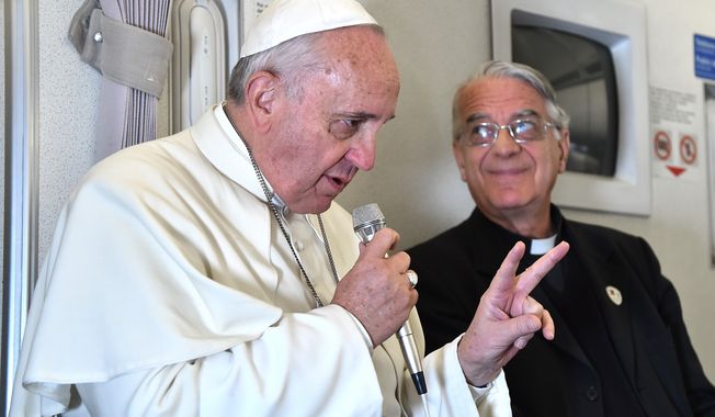 Pope Francis talked about &quot;responsible parenthood&quot; with journalists during his flight from Manila to Rome, Monday, Jan. 19. In a later interview, a cleric clarified that the pontiff&#x27;s words about not acting like &quot;rabbits&quot; were misunderstood by the press; large families are beautiful and valuable. (AP Photo/Giuseppe Cacace, pool)