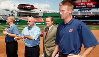 Sports agent Scott Boras (second from right) once predicted players would want to play in D.C. Boras has made several deals with Nationals general manager Mike Rizzo (second from left), including pitcher Stephen Strasburg (right), and Max Scherzer. (Associated Press)