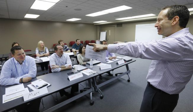 In a demographic shift, the millennial generation is expected to outnumber the baby boom generation this year. One implications of such a change is that more people from differing generations are likely to work together. This August 2013 photo shows Brad Karsh of JB Training Solutions speaking to a group of generation X'ers at a manufacturing company in Chicago. Some people generalize that baby boomers are workaholics, Gen Xers demand a work-life balance, and millennials are masters of technology and have high, high expectations. (AP Photo/M. Spencer Green) ** FILE **
