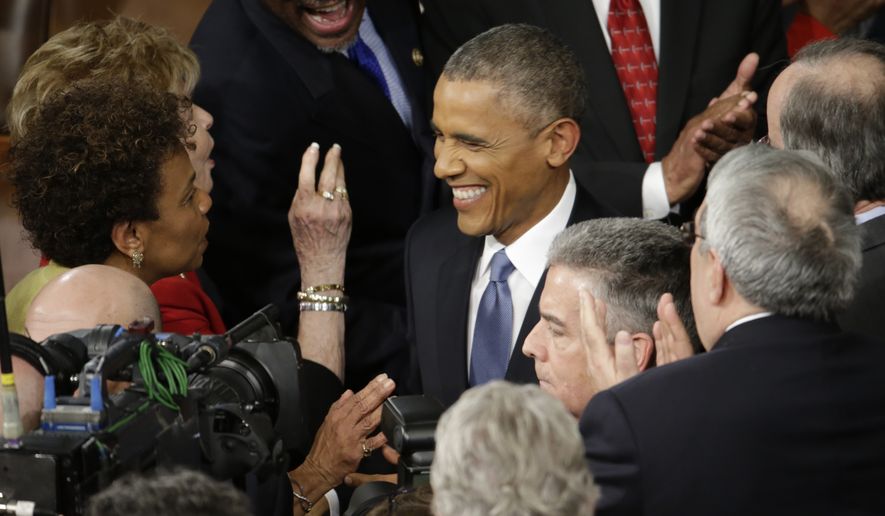 President Barack Obama is greeted on  Capitol Hill in Washington, Tuesday, Jan. 20, 2015, before his State of the Union address before a joint session of Congress. (AP Photo/Pablo Martinez Monsivais)