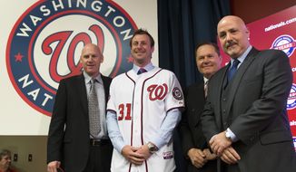 Washington Nationals pitcher Max Scherzer, second from left, poses for photographs during an introductory news conference at Nationals Park, on Wednesday, Jan. 21, 2015, in Washington. Scherzer signed a $210 million, seven- year contract to join the Nationals. From left, Nationals manager Matt Williams, Scherzer, Scherzer&#x27;s agent Scott Boras, and Nationals general manager Mike Rizzo. (AP Photo/Evan Vucci)  
