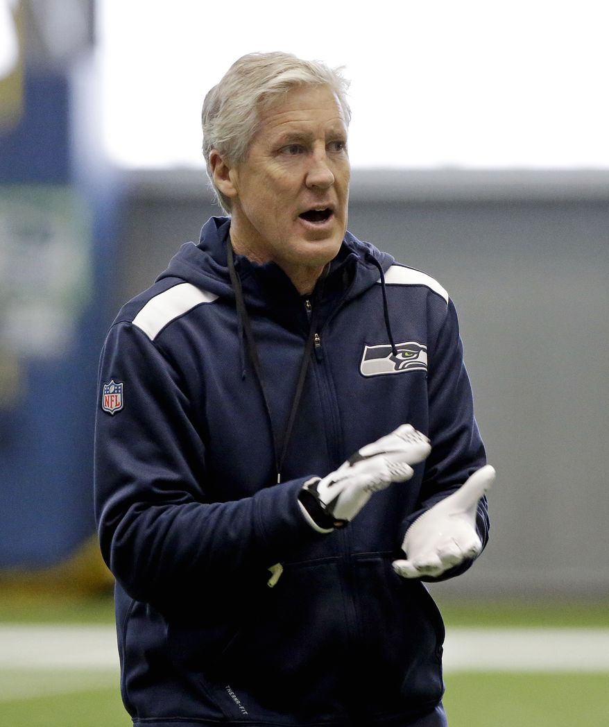 Seattle Seahawks head coach Pete Carroll walks in practice Wednesday, Jan. 21, 2015, in Renton, Wash. The Seahawks play the New England Patriots in the Super Bowl Feb. 1 in Glendale, Ariz. (AP Photo/Elaine Thompson)
